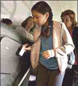 A student scanning her computer surveillance badge