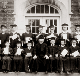 A photograph of a priest-teacher and his class at St John's Croatian School