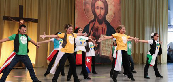 WYD rock dance practice in front of religious images