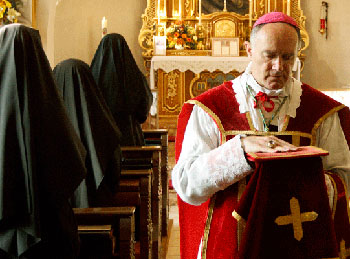 Bishop Fellay leaving the altar