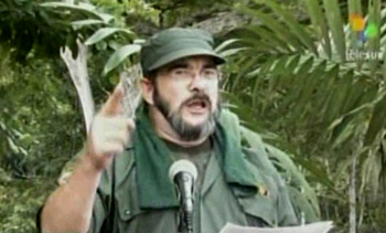 FARC guerillia Timochenko speaking into a microphone