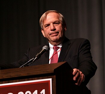 William J. Olsen at a podium