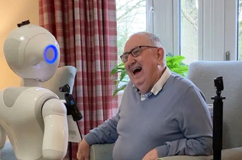 Old man talking with a robot