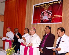 Salvatore Pennachio praying with false religious leaders