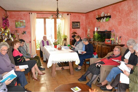 a mass gathering in the living room of a house