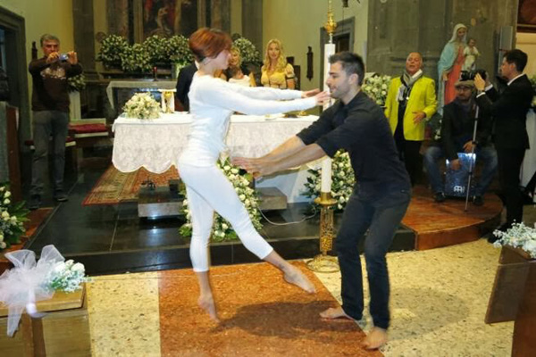 A dance being performed in front of the altar of San Lorenzo Church, Rome