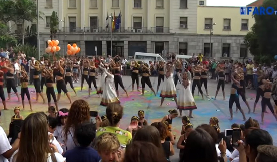 Women dancing in the streets to honor Ganesh