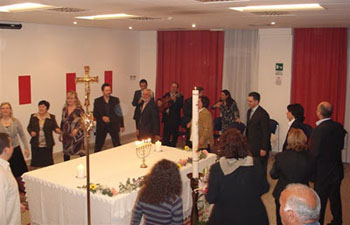 neocatechumenal dancing and singing around an altar table